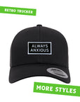 "Always Anxious" in white block text embroidered on black patch with white merrowed edge on a curved brim snap back. Art by Print Ritual.