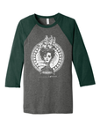 Image encompassing classic nautical themes, in white ink on a grey shirt with green sleeves. Art by Sam Enlow.